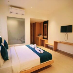 Classic room interior at Vrindavan Hotel with double bed, AC and modern amenties